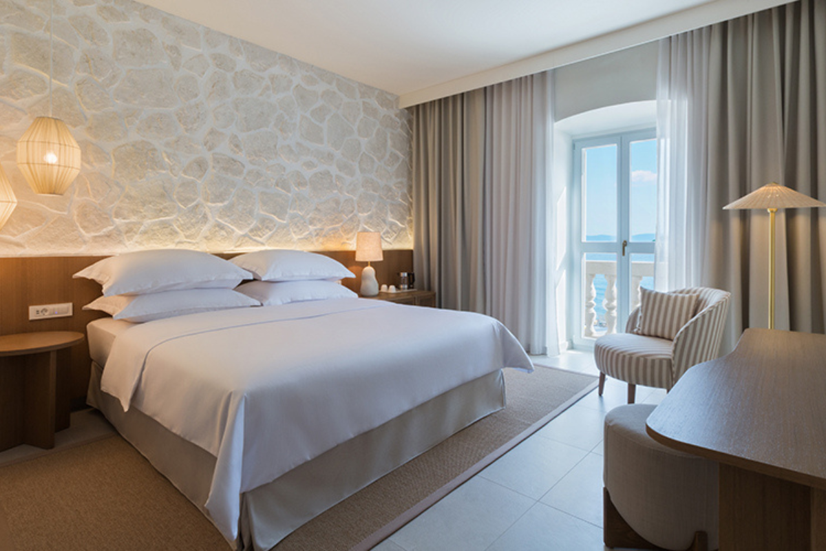 a room with a bed and a chair