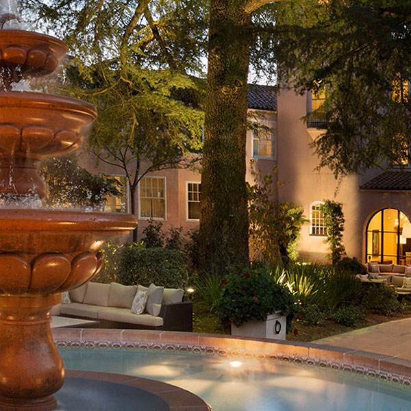 a fountain in front of a house