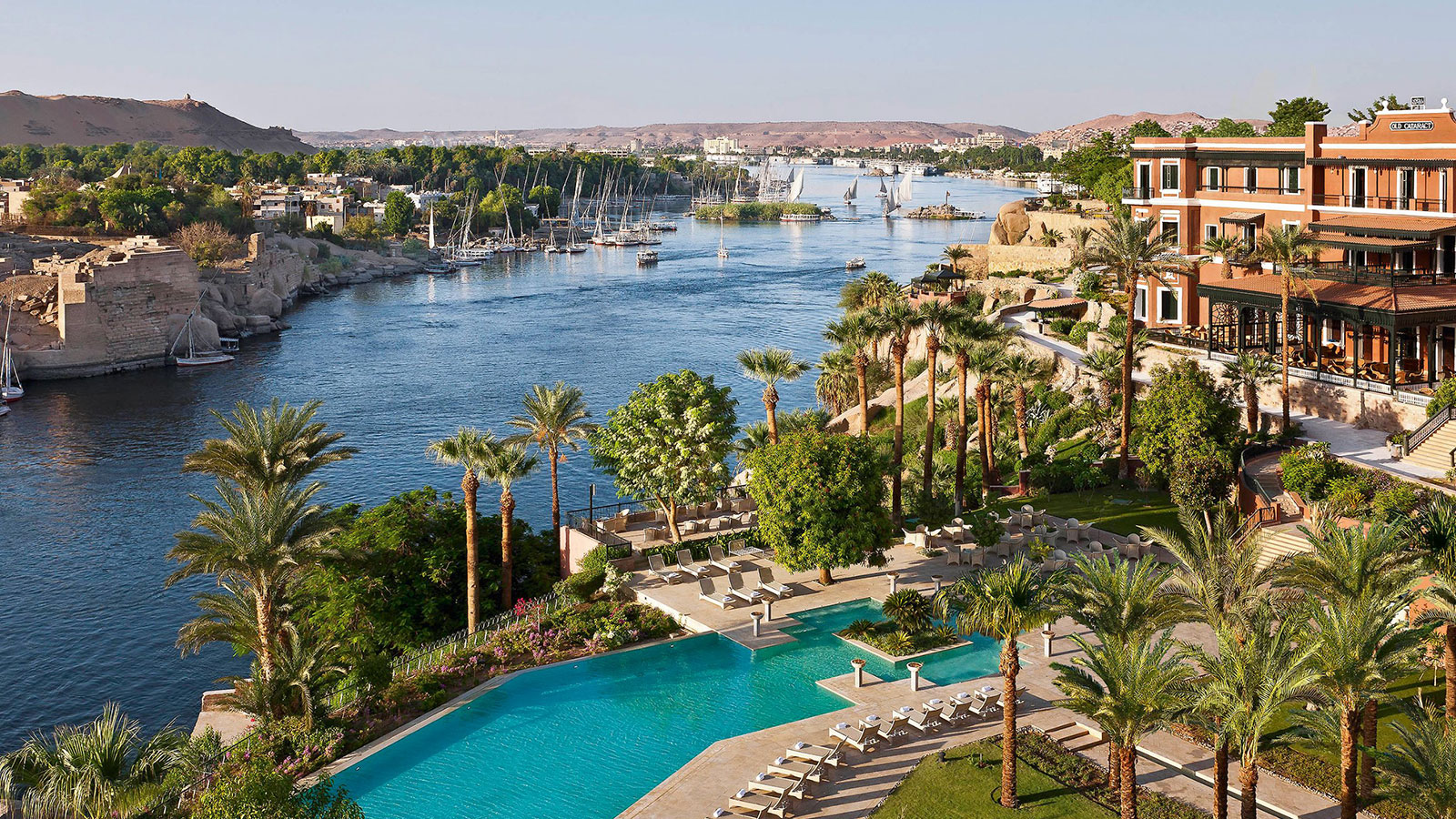 a swimming pool next to a body of water