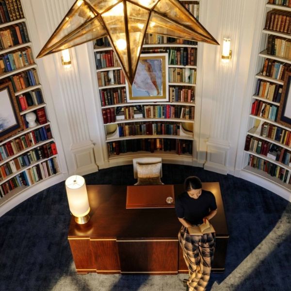 a woman standing in a library