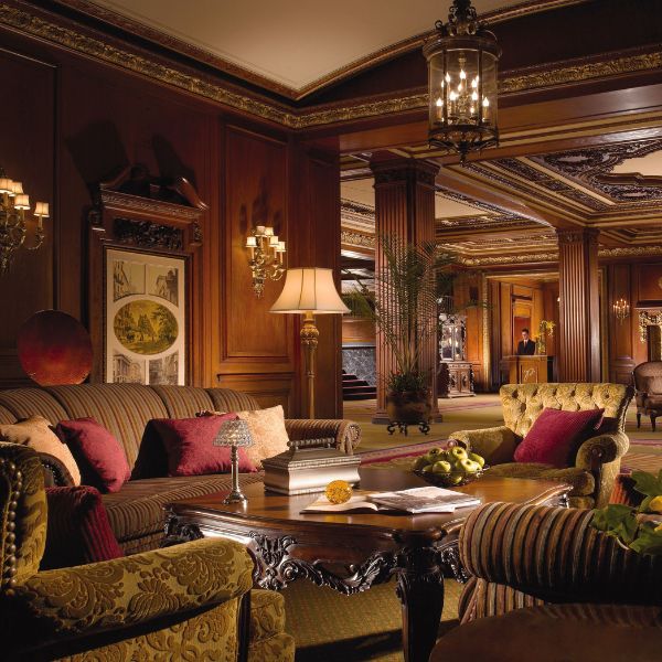 a room with a large sofa and couches