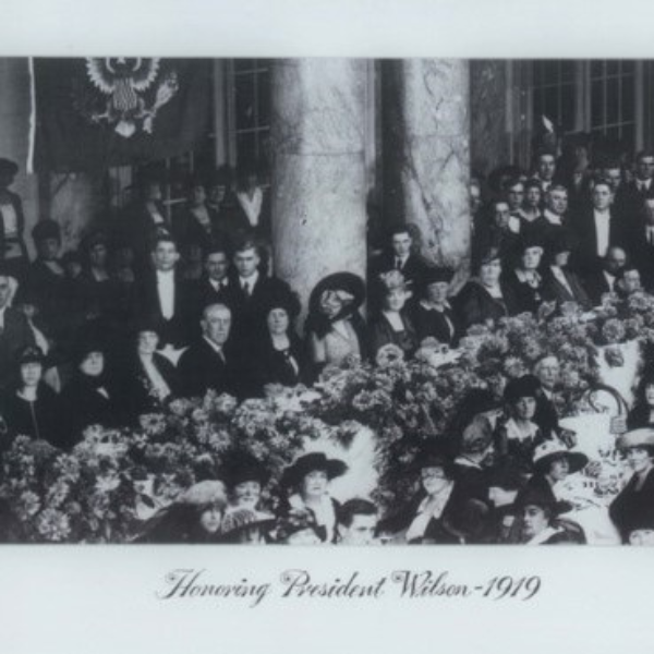 a group of people sitting in a row