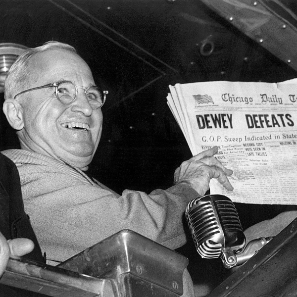 a man holding a newspaper