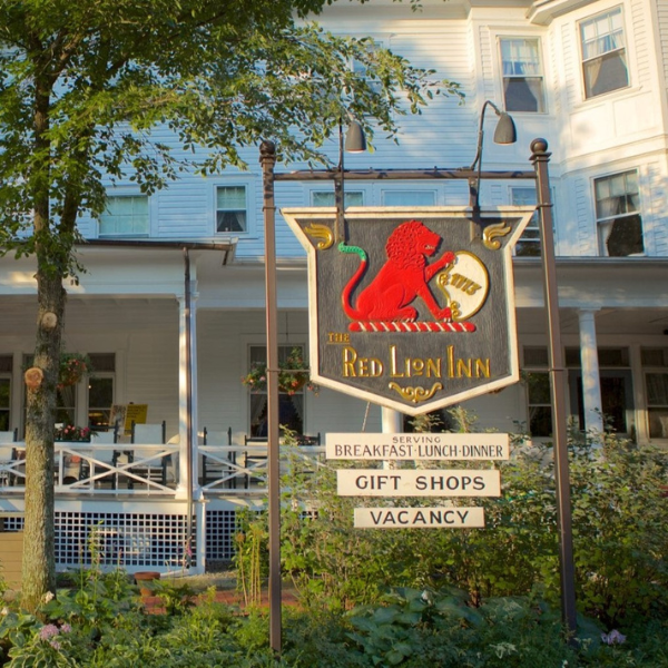 a sign in front of a hotel