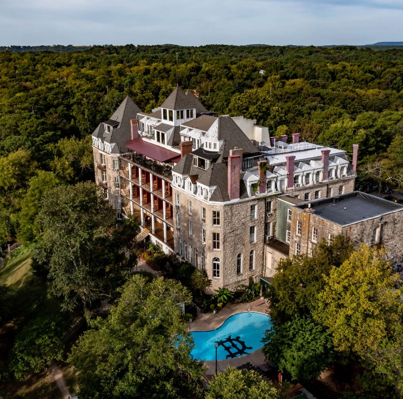 a large building surrounded by trees