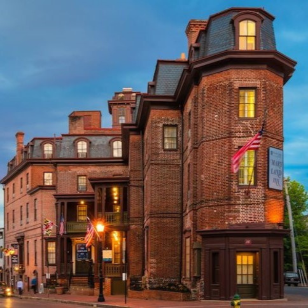 a brick building with flags on the side of it