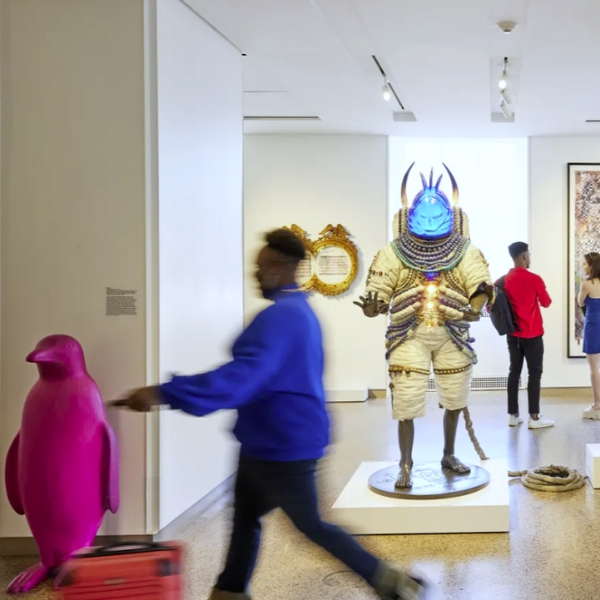 people walking in a museum