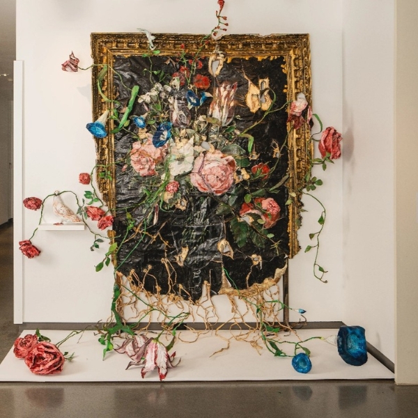 a painting with flowers and vines on a wall