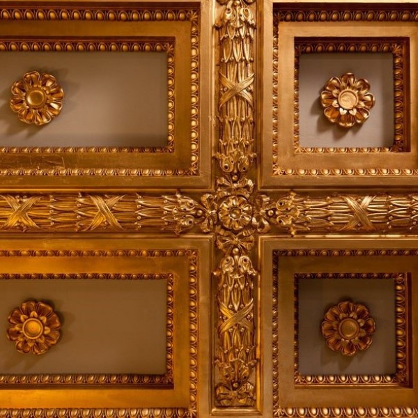 a gold ceiling with floral designs