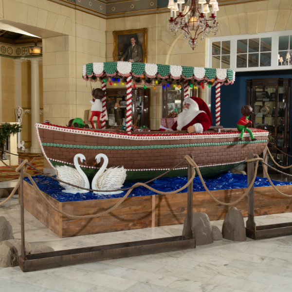 a santa claus on a boat in a room