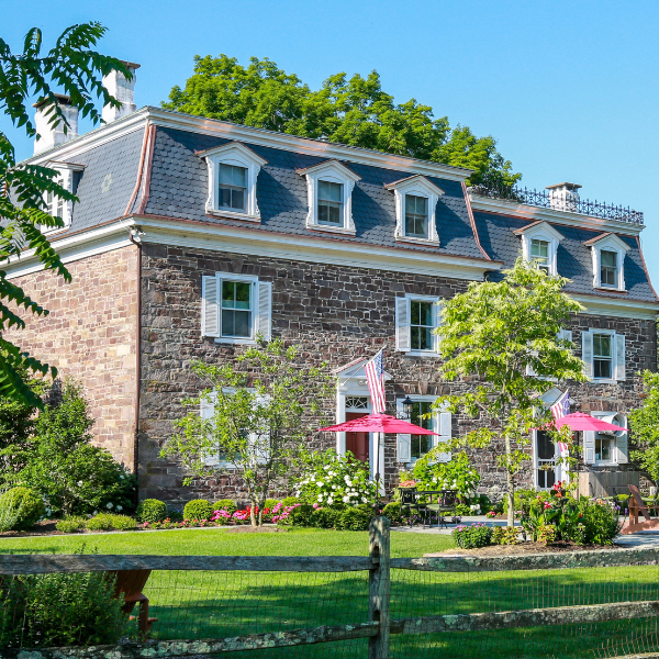 a house with a lawn and trees