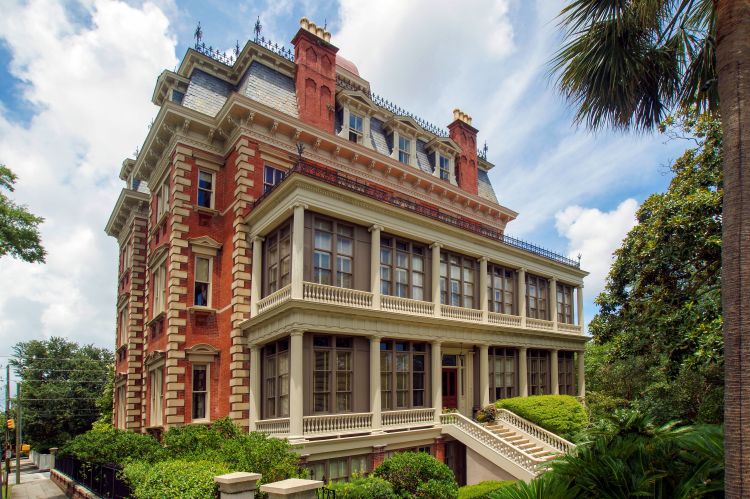 a large brick building with a few stairs