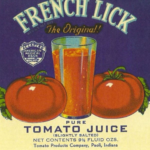 a label with tomatoes and a glass of juice