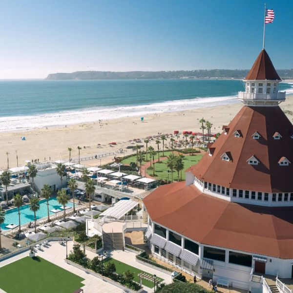 a building with a flag on top and a beach