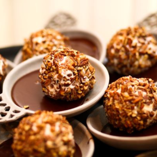 a group of round brown and white desserts