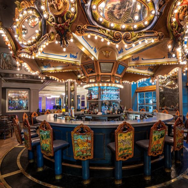 a bar with a bar and chairs