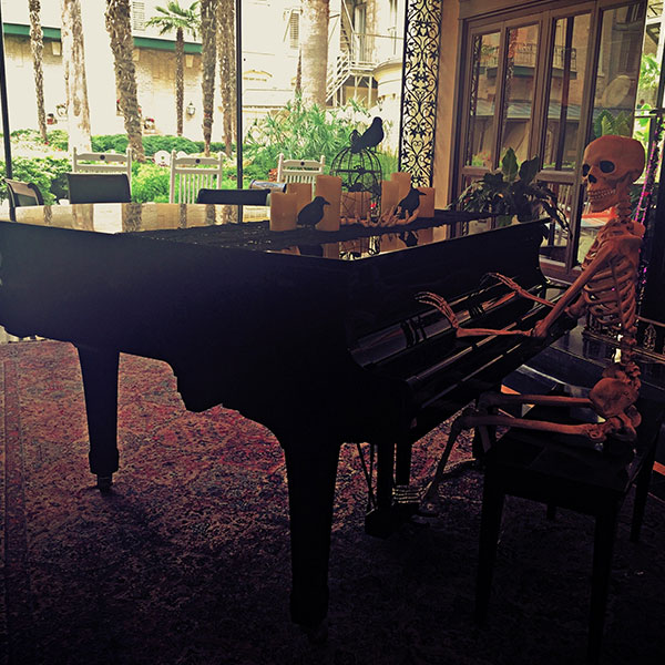 a skeleton playing a piano