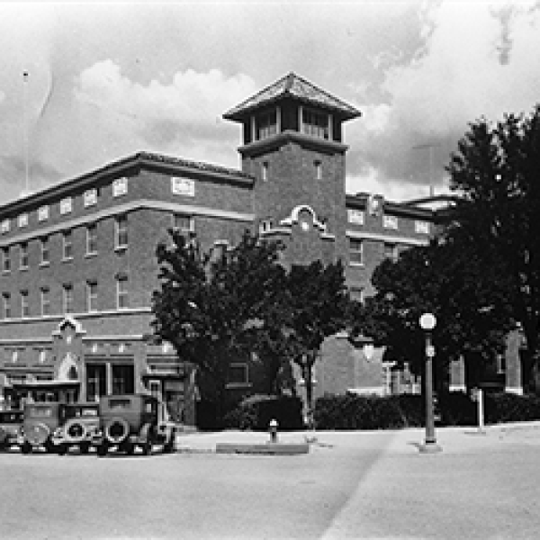 a building with a tower and a train
