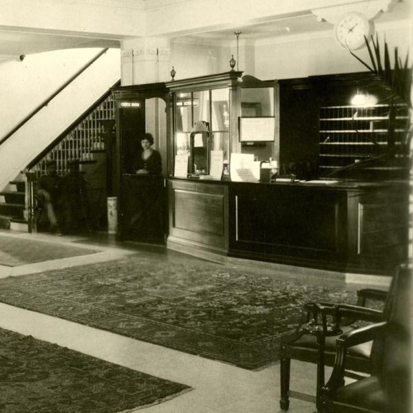 a black and white photo of a reception desk