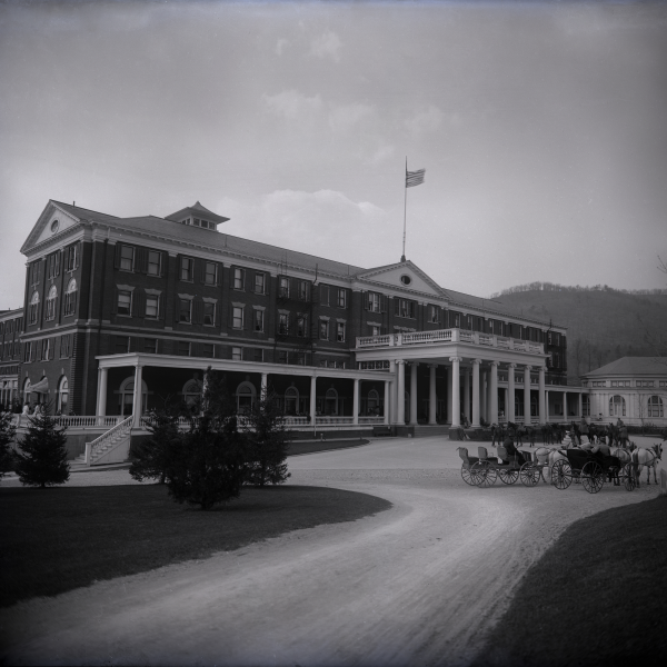 a horse carriage in front of a large building