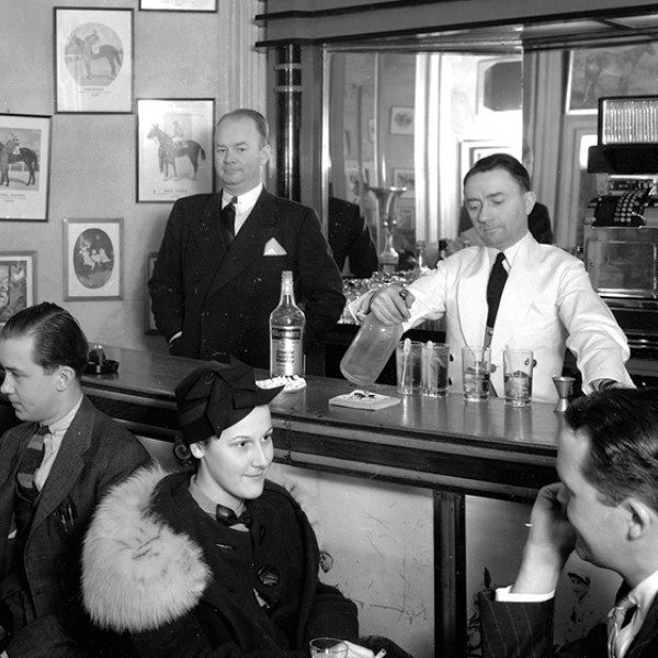 a group of people sitting at a bar