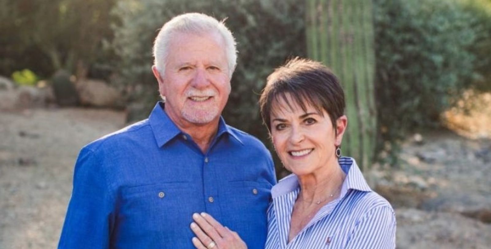 a man and woman smiling for a picture
