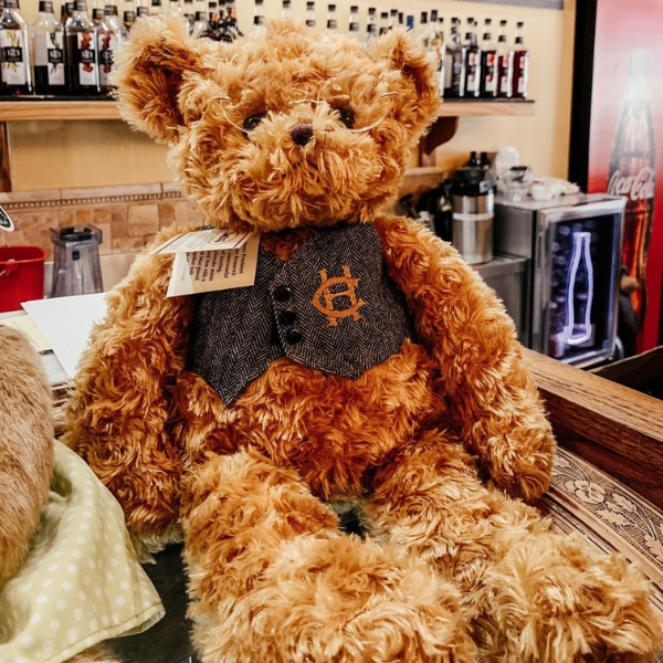 a stuffed bear sitting on a counter