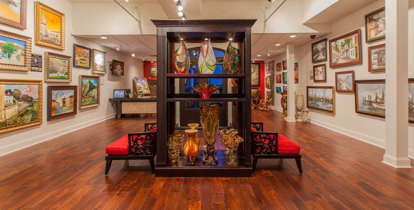 a display case with art pieces on it