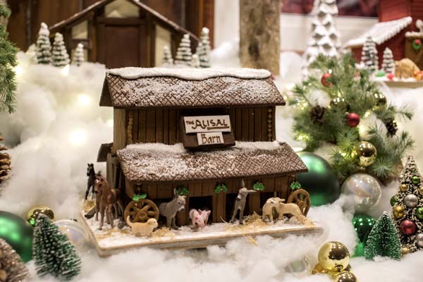 a small house with a building and decorations