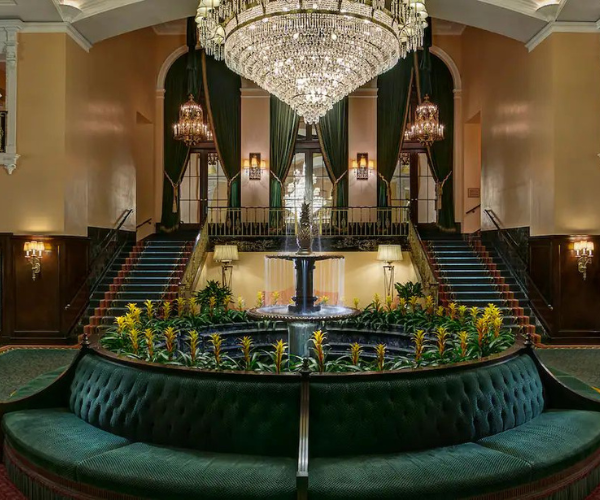 a chandelier in a room with a fountain