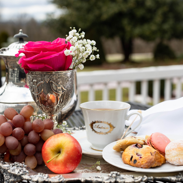 a plate of food and a cup of tea on a table