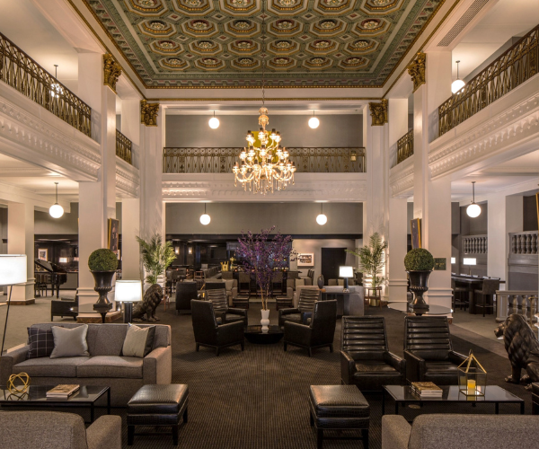 a large room with a chandelier and chairs