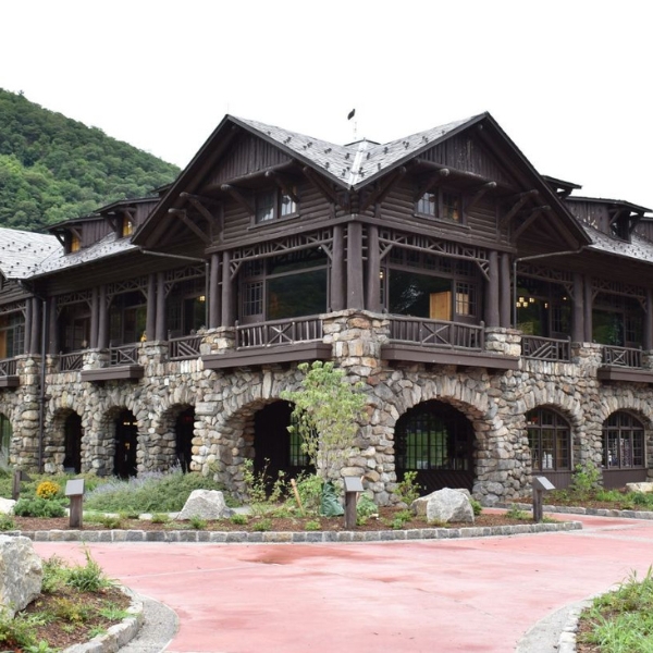 a large building with a stone driveway