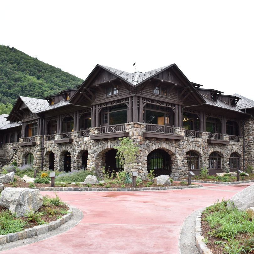 a large building with a red path and a red path