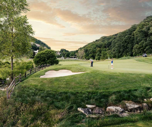 a group of people playing golf