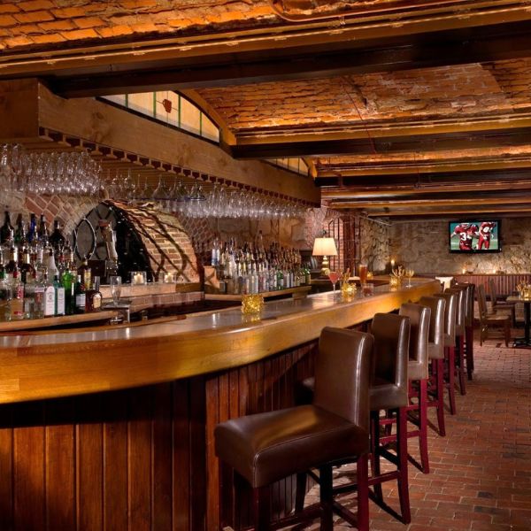 a bar with many bottles of wine