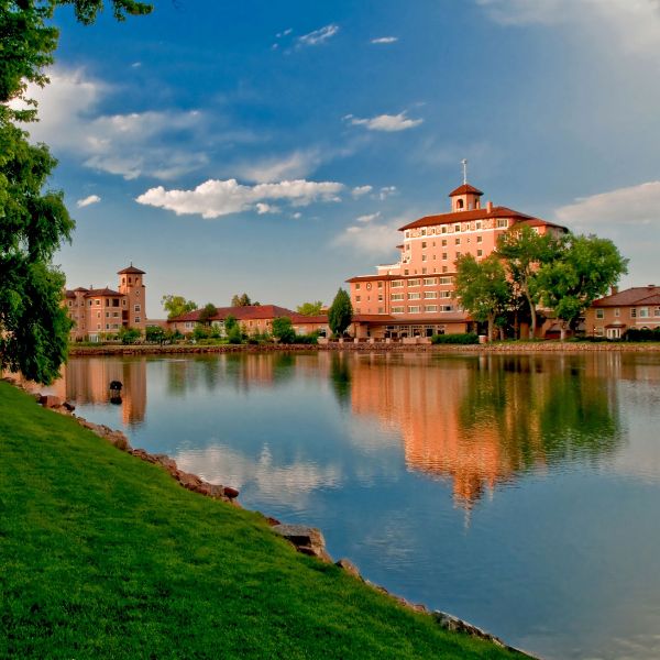 a body of water with a building in the background