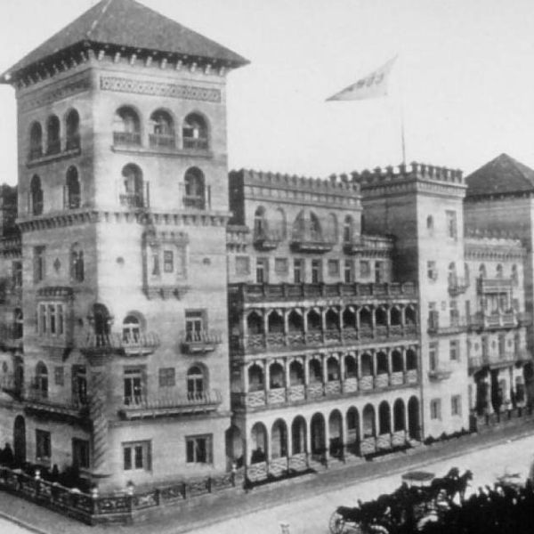 a large building with a flag on top
