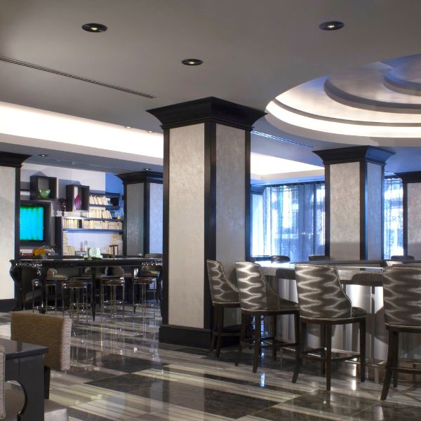 a room with a bar and chairs