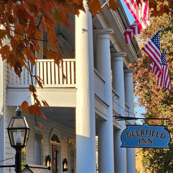 a building with a sign and flags
