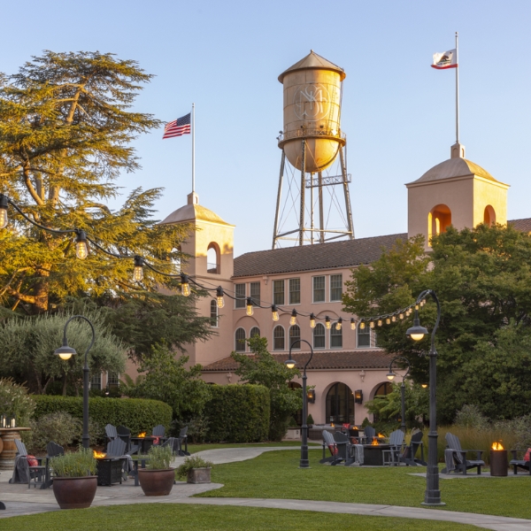a building with a water tower and flags