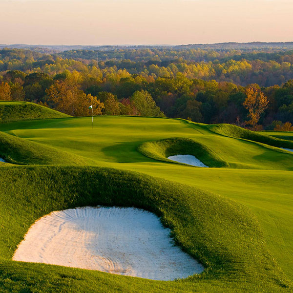a golf course with sand bunkers