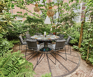 a table and chairs in a courtyard