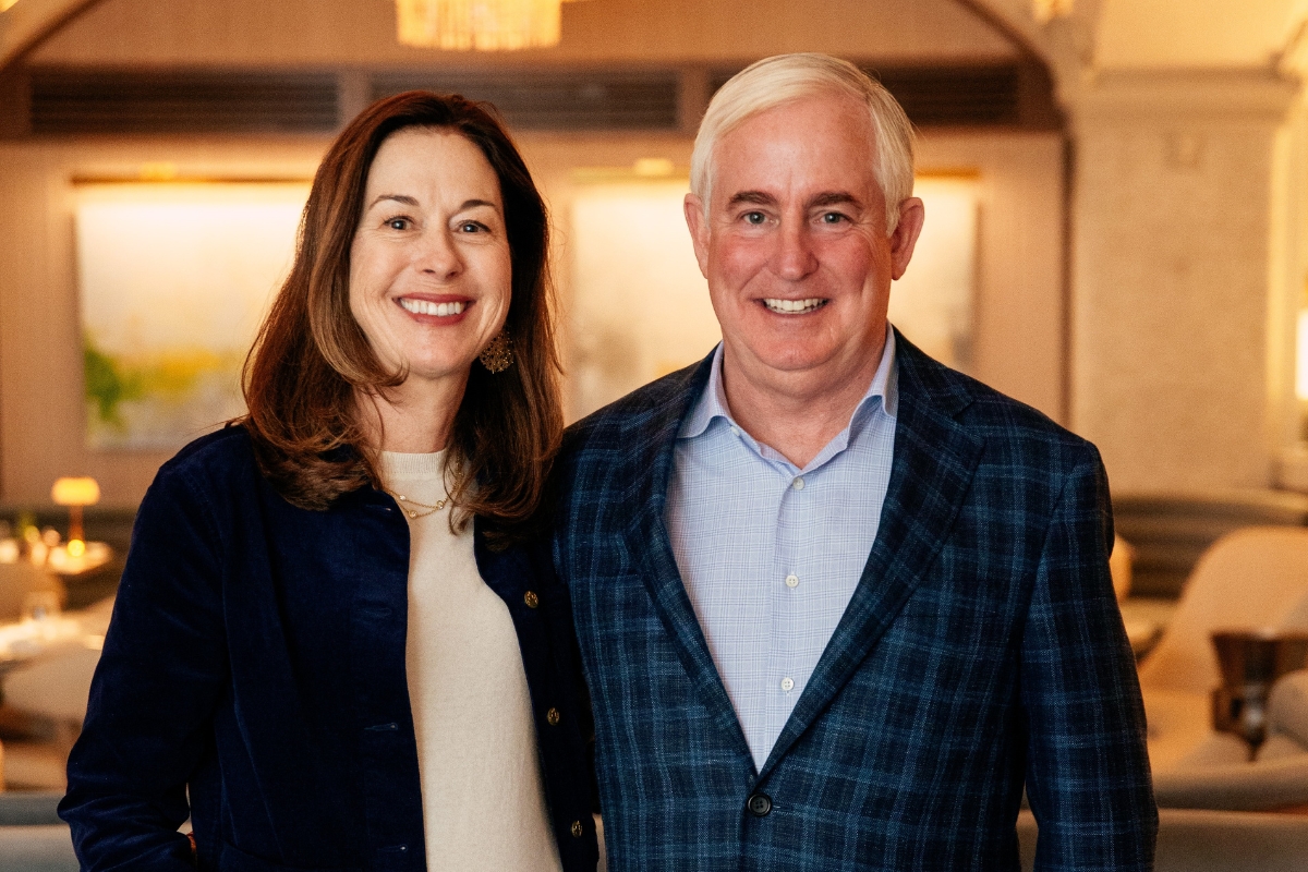 a man and woman smiling for a picture