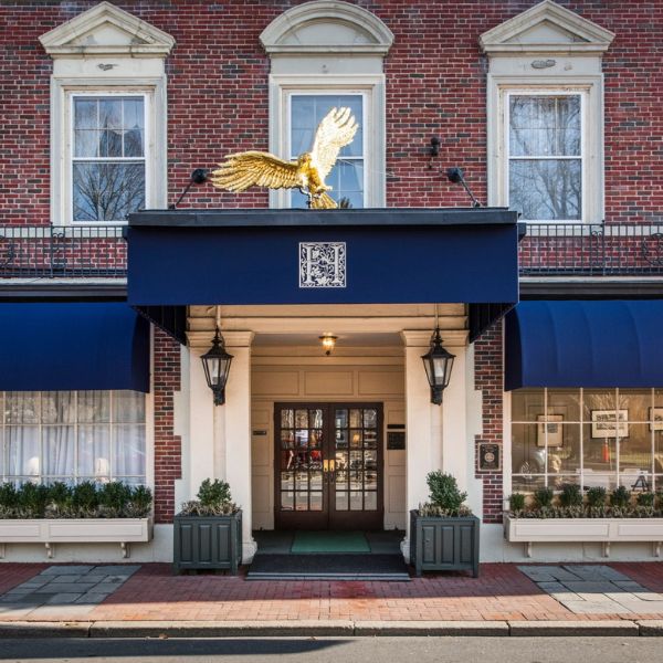 a building with a gold eagle statue on top of it