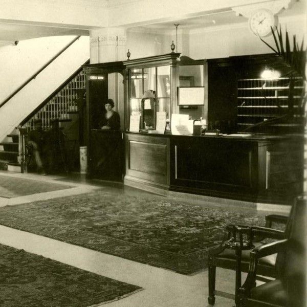 a black and white photo of a reception desk