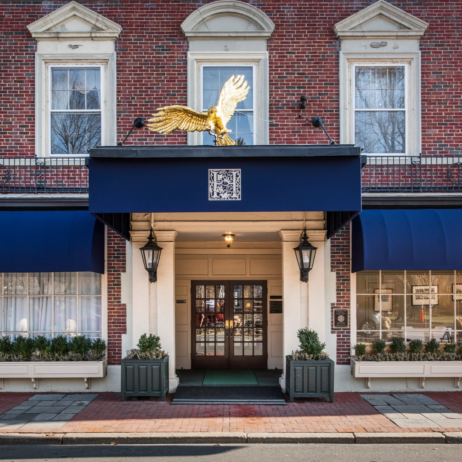 a building with a gold eagle statue on top of it