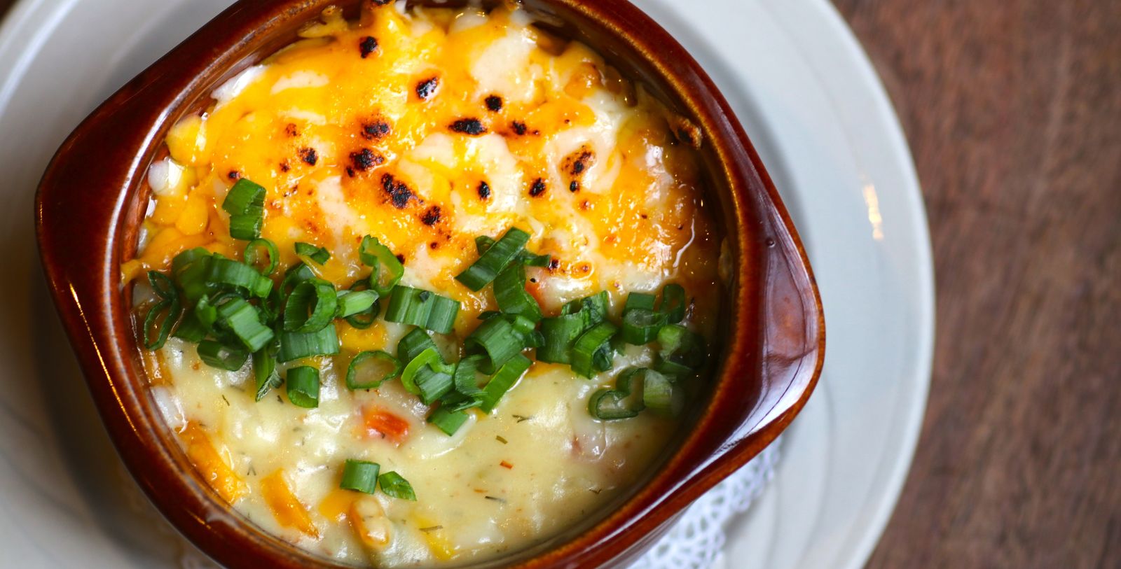 a bowl of food with green onions