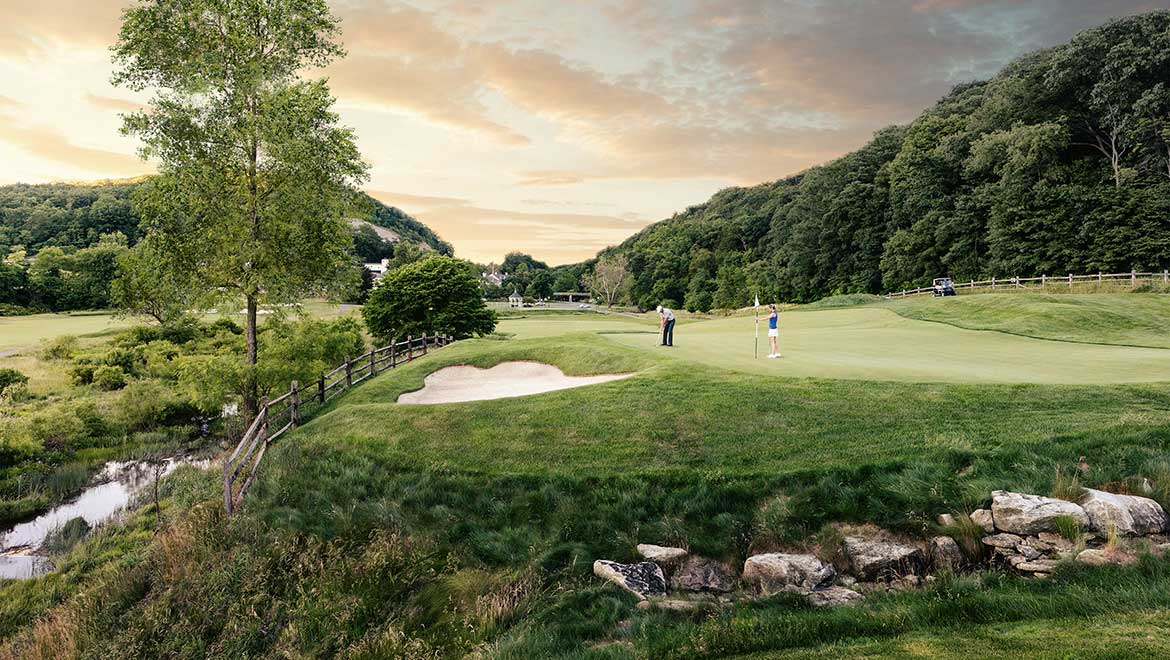 a group of people on a golf course