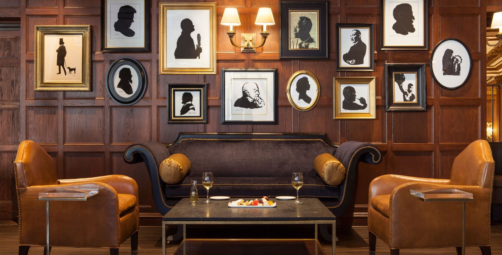 a room with a couch and pictures on the wall